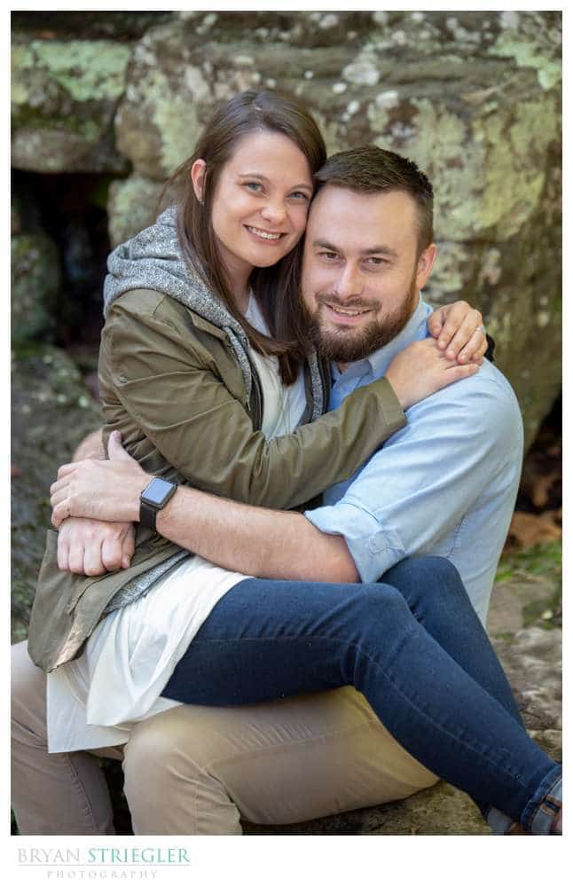 engagement photo sitting on his lap